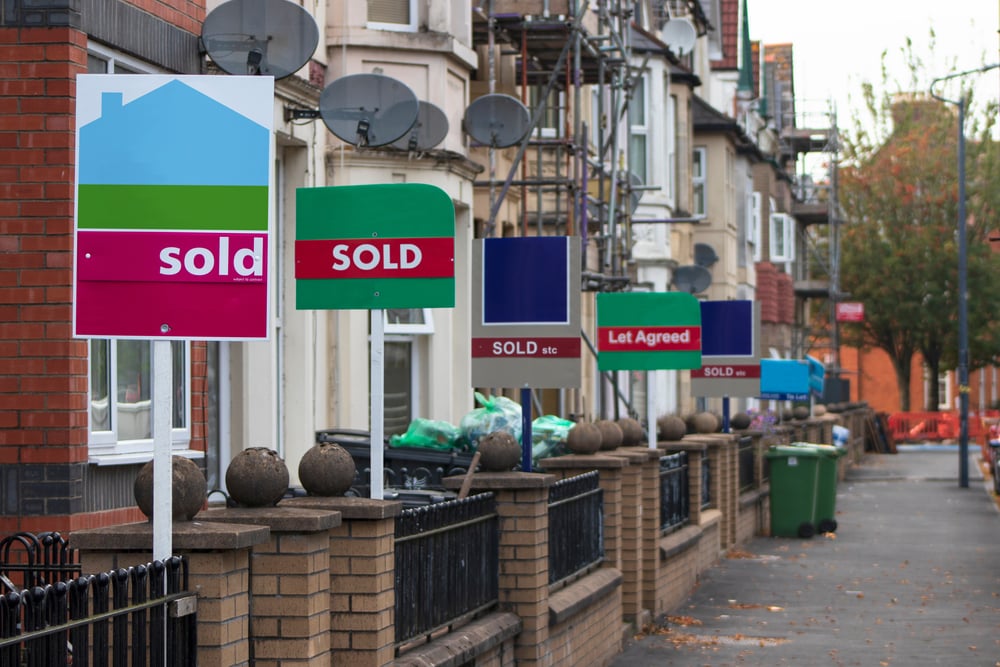 sale boards on a street