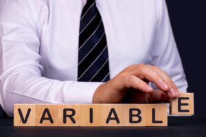 man with blocks indicating business variables