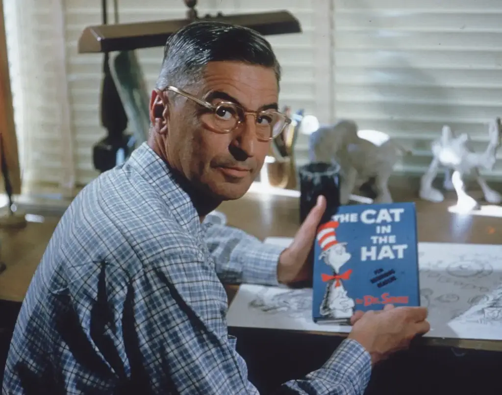 Dr Suess holding Cat in the hat book